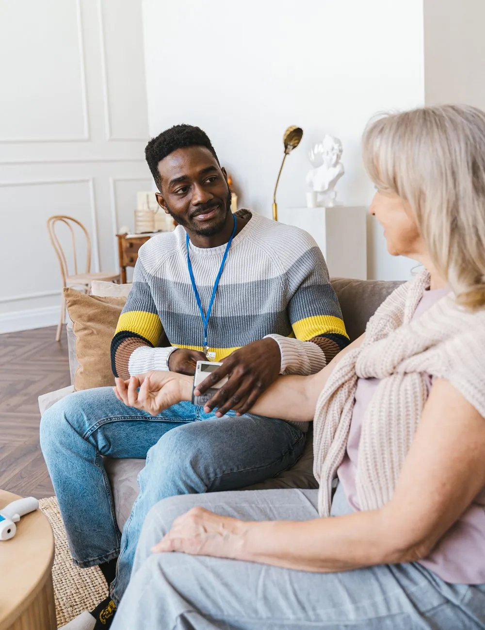 Homeable caregiver checking in with a client at home